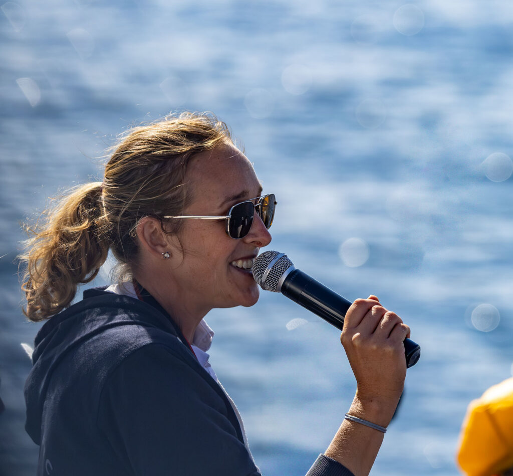 Emerald Clipper First Mate and Naturalist, Lauren Ryan-Booth is in her element, teaching about whales